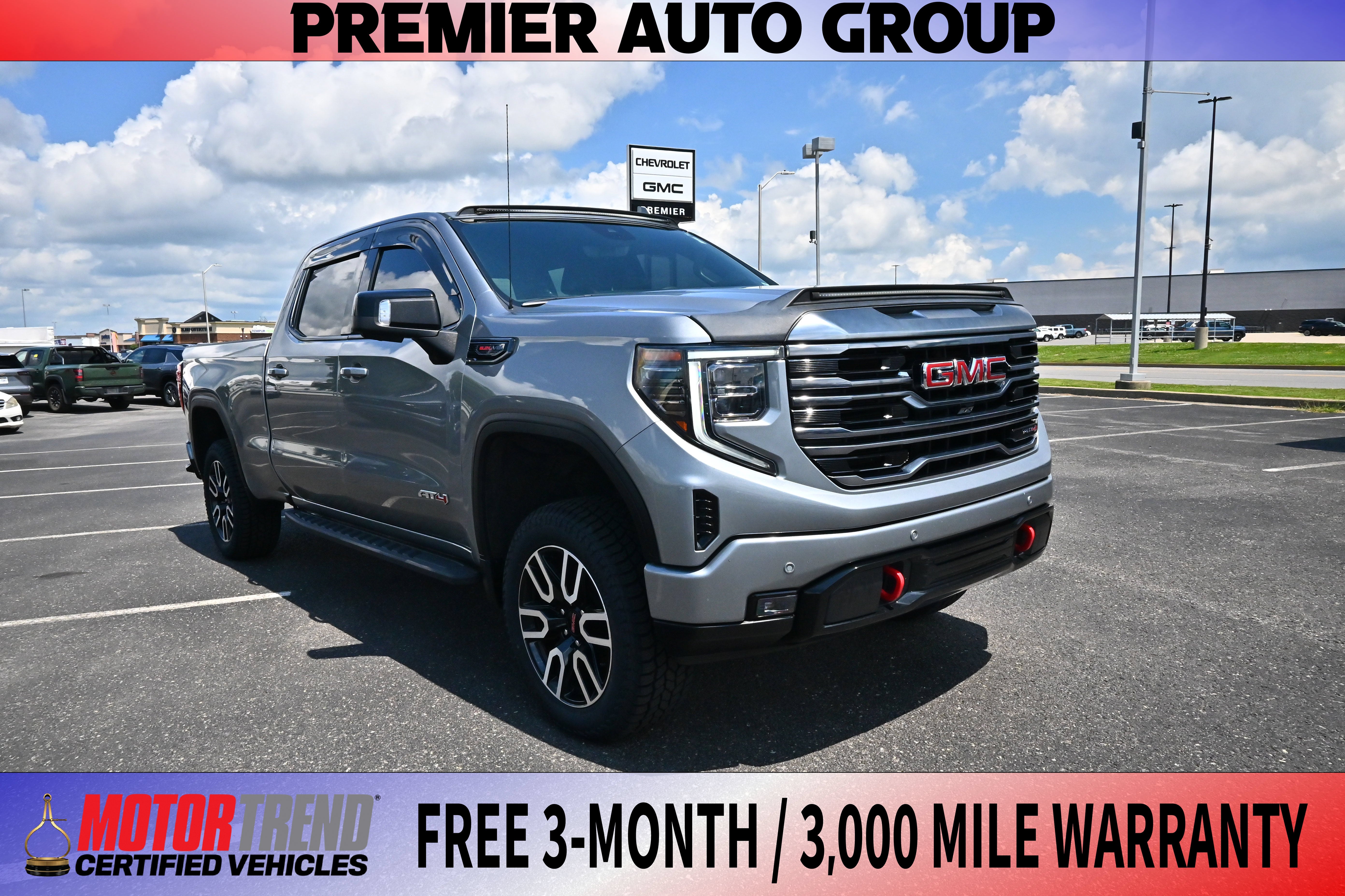 2024 GMC Sierra 1500 AT4 in Sterling Metallic — front three-quarter view