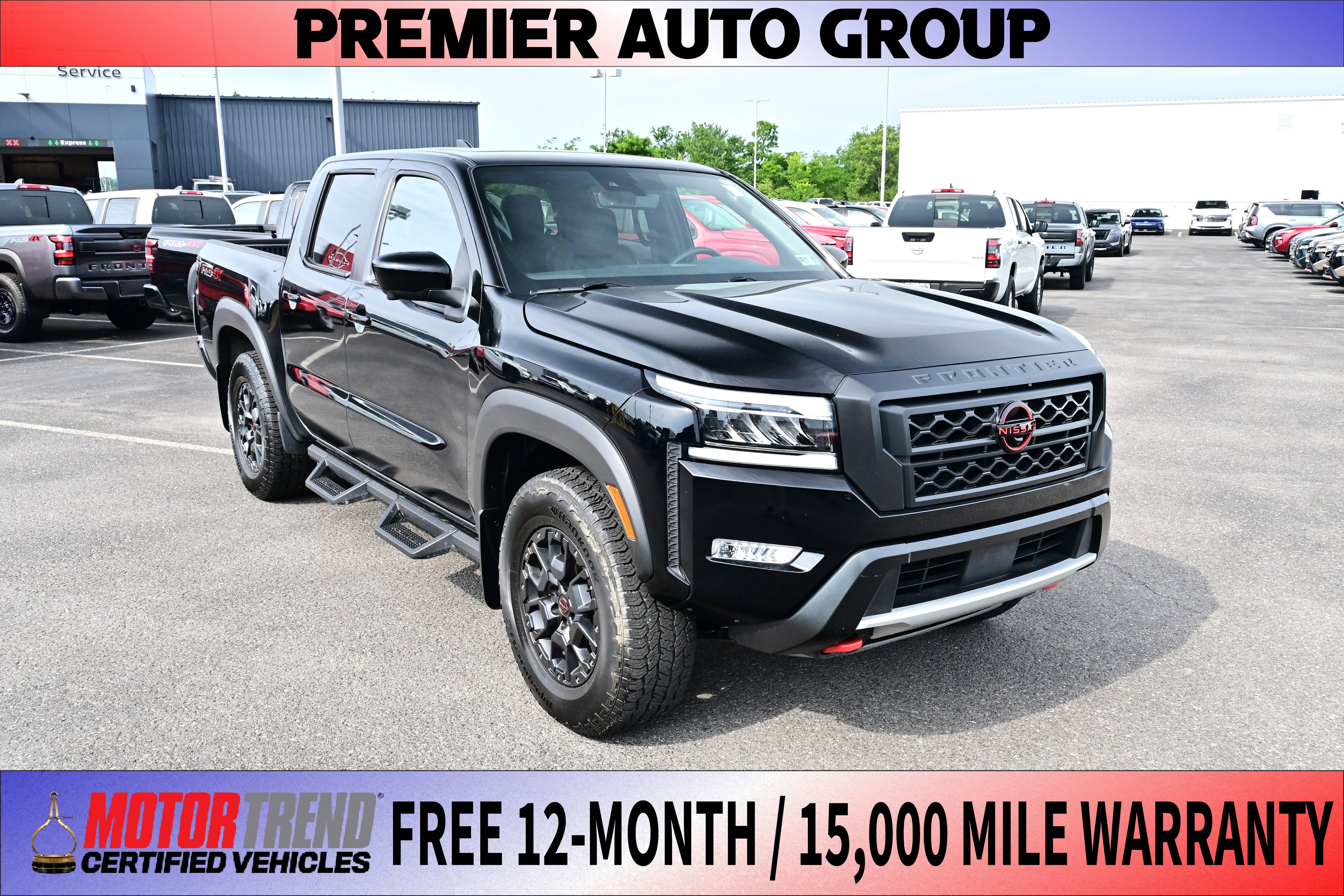 2024 Nissan Frontier PRO-4X in Kh3/Super Blac — front three-quarter view