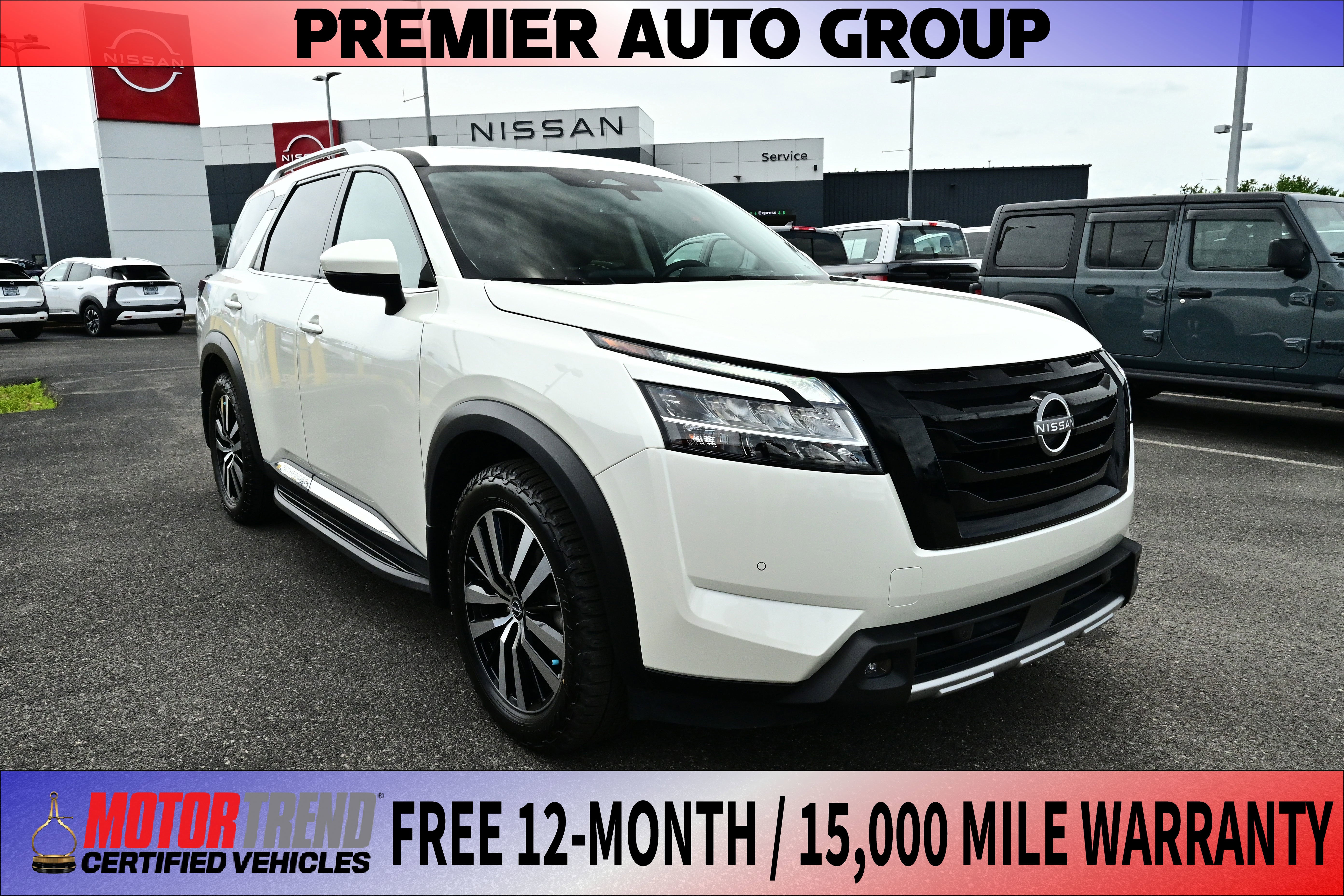2023 Nissan Pathfinder Platinum in Qab/White — front three-quarter view